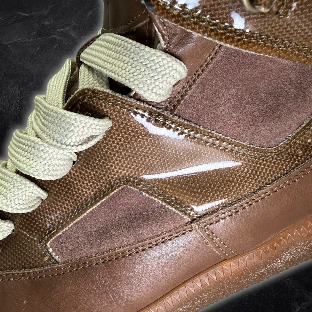 Maison Margiela “22 line” high
top sneakers (brown)